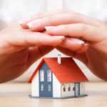 House covered of woman hands insurance real estate concept