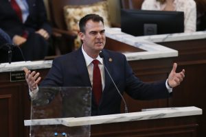 Gov. Stitt Under Fire Over Twitter Photo