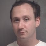 Andrew Garrison, Newstalk KZRG, domestic assault