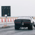 Dragster sets off on the racetrack. Dragster on the speedway. Dr