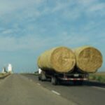Truck transporting hay bales