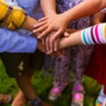 Kids standing in the circle and joining hands together